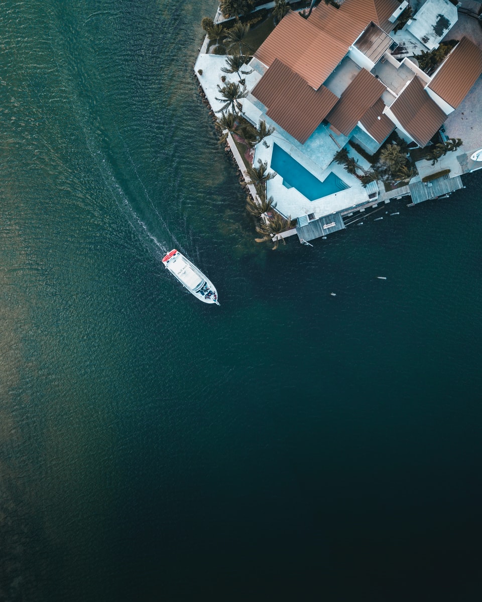Photo by Gautier Salles bird's eye view of boat on body of water